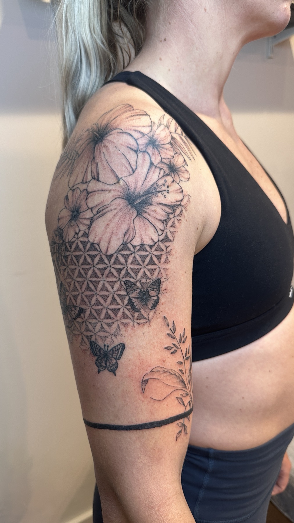 Botanical geometric shoulder tattoo