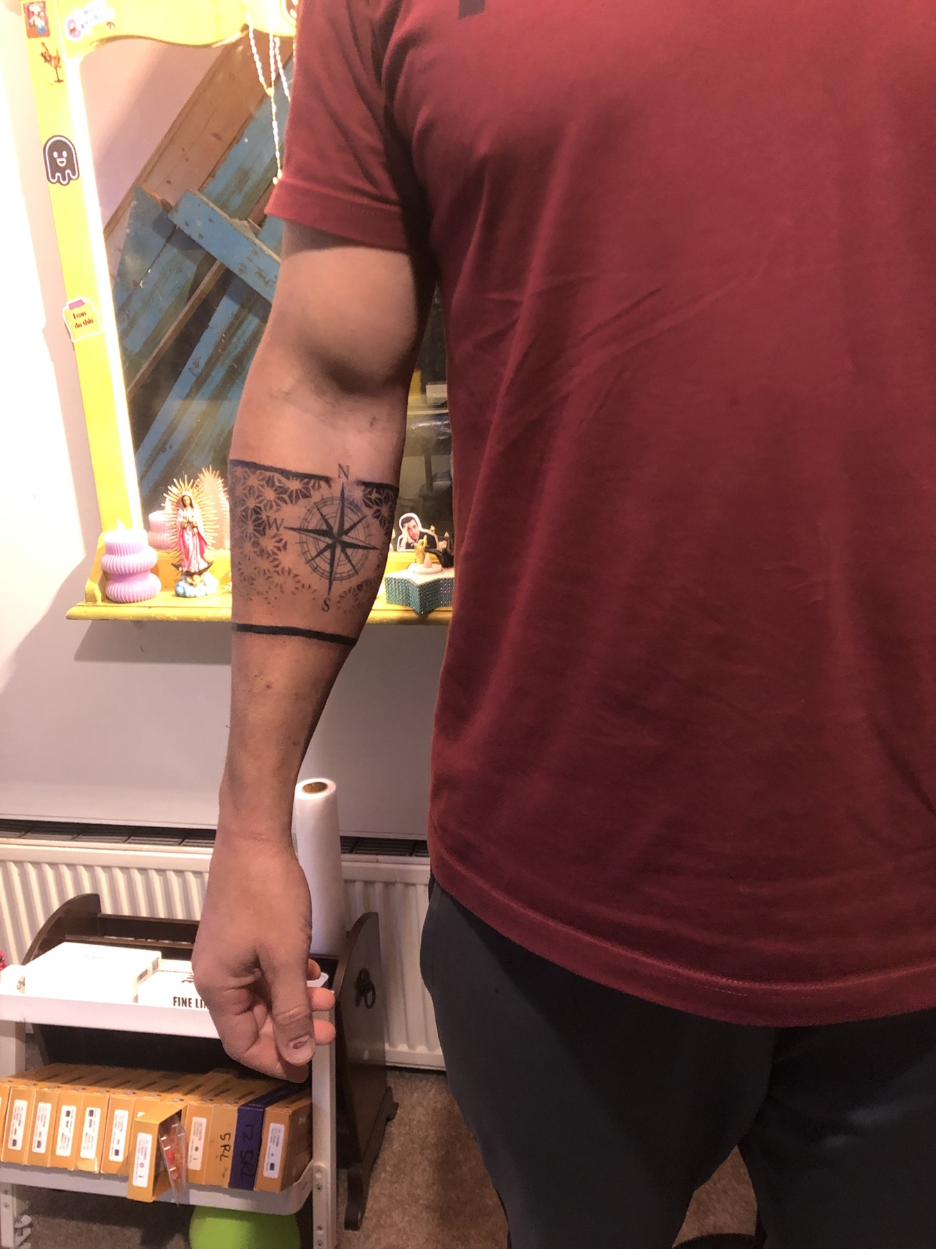 Geometric compass forearm tattoo