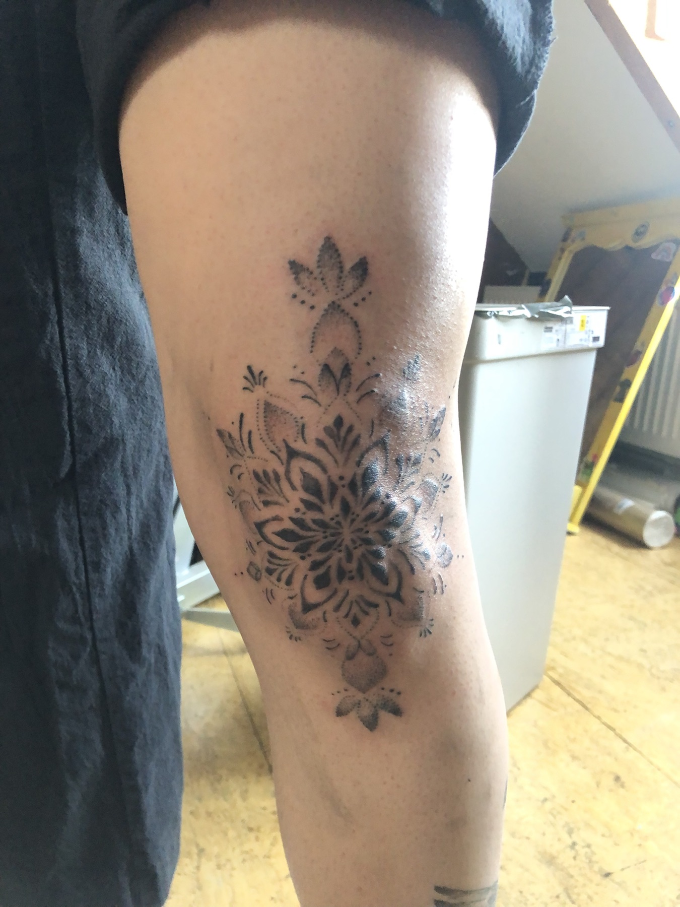 Floral mandala thigh tattoo