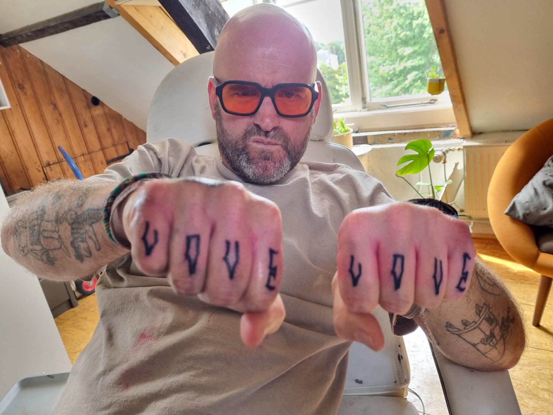 Paired LOVE knuckle tattoos