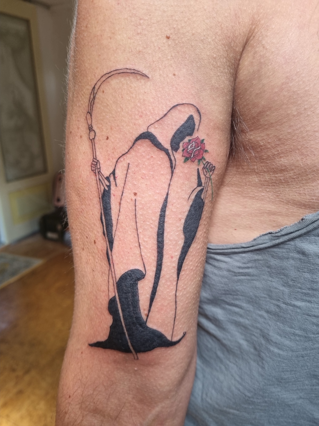 Playful penguin pair tattoo
