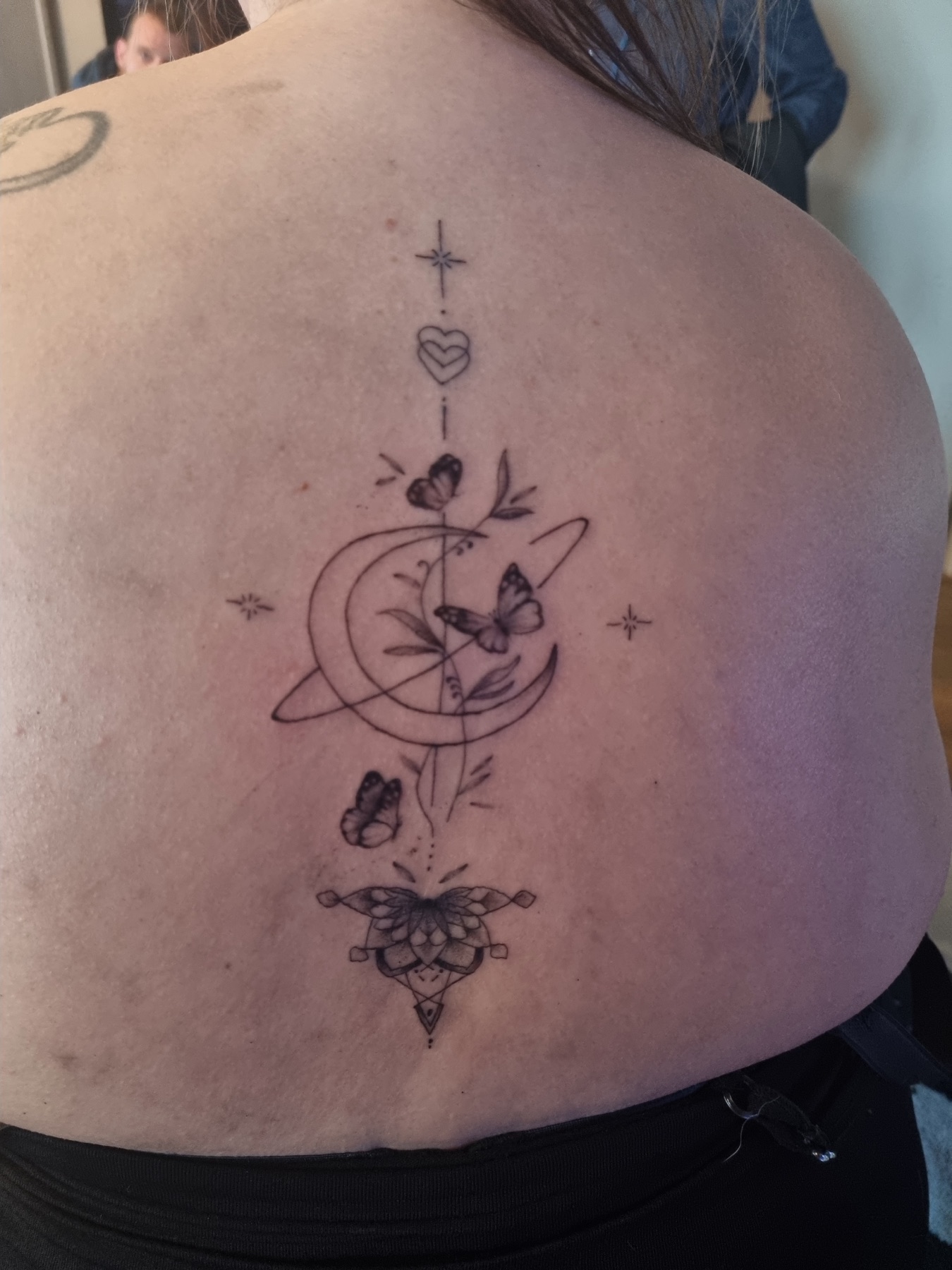Moon and butterfly back tattoo
