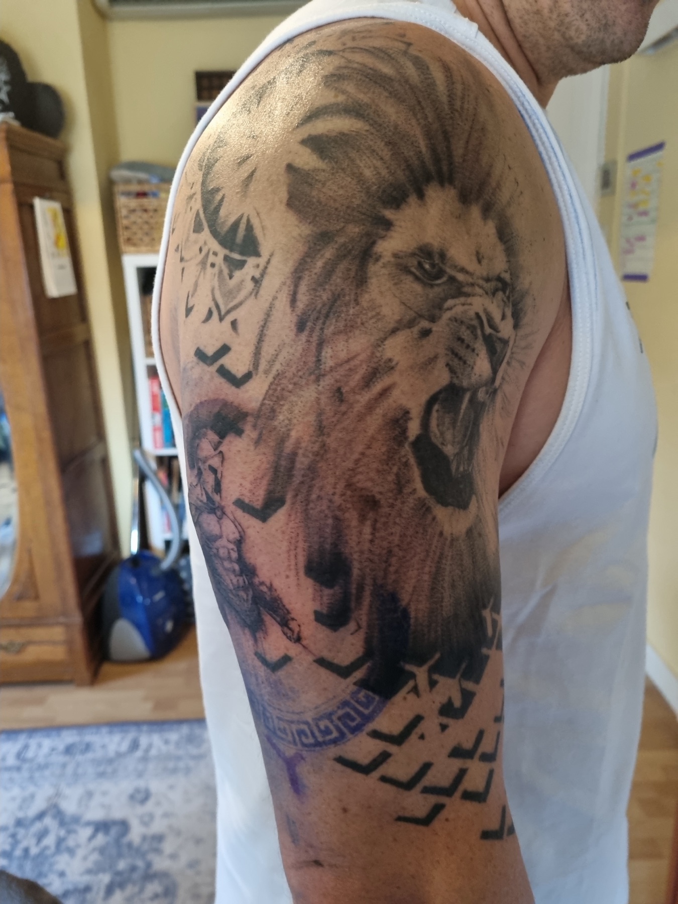 Realistic lion sleeve tattoo